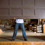 Man and garage door