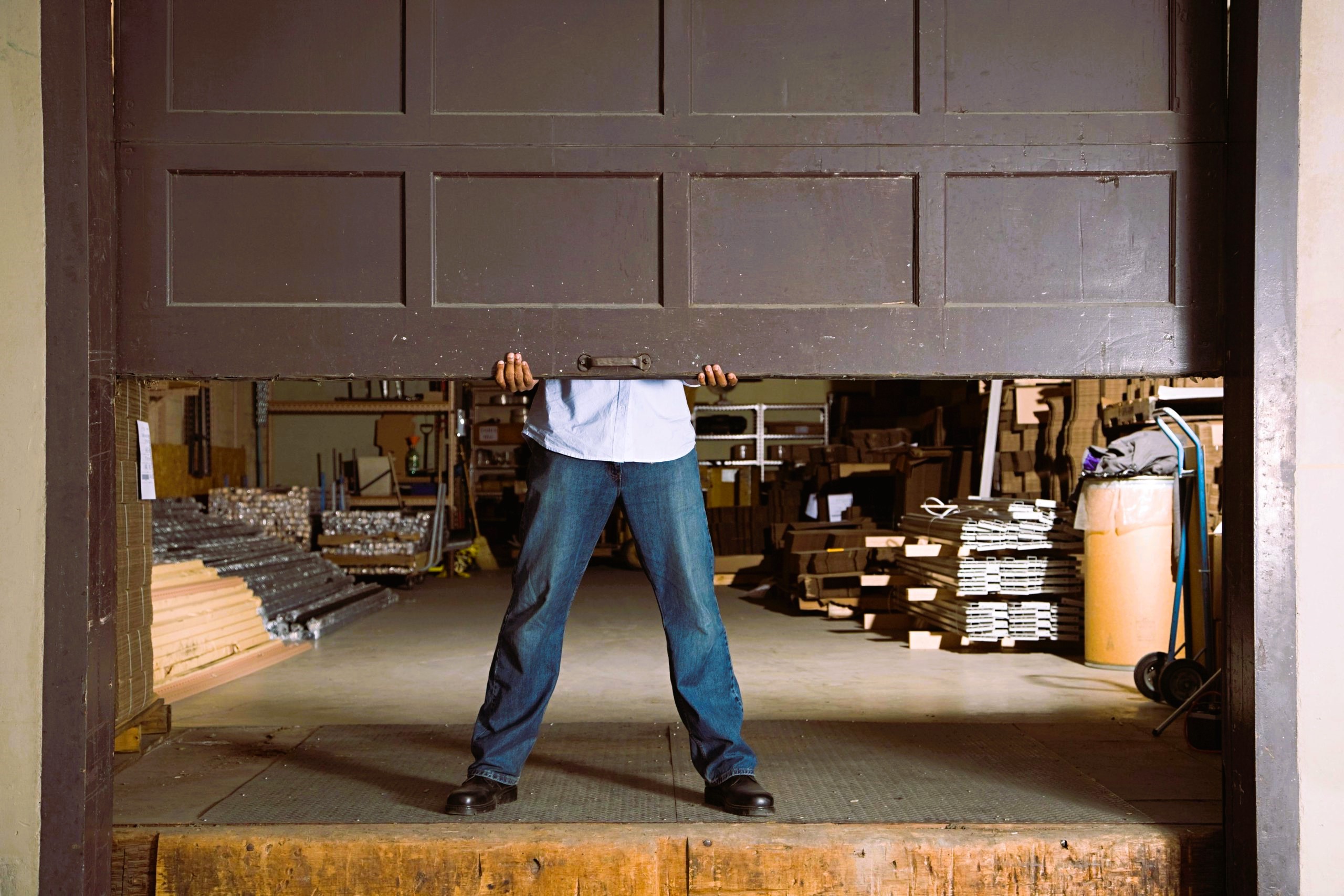 Man and garage door