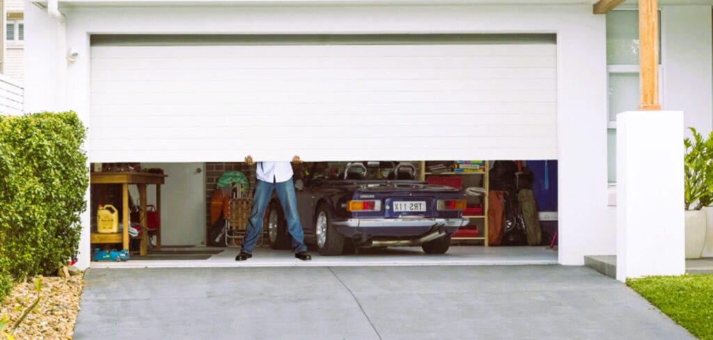man lifting garage